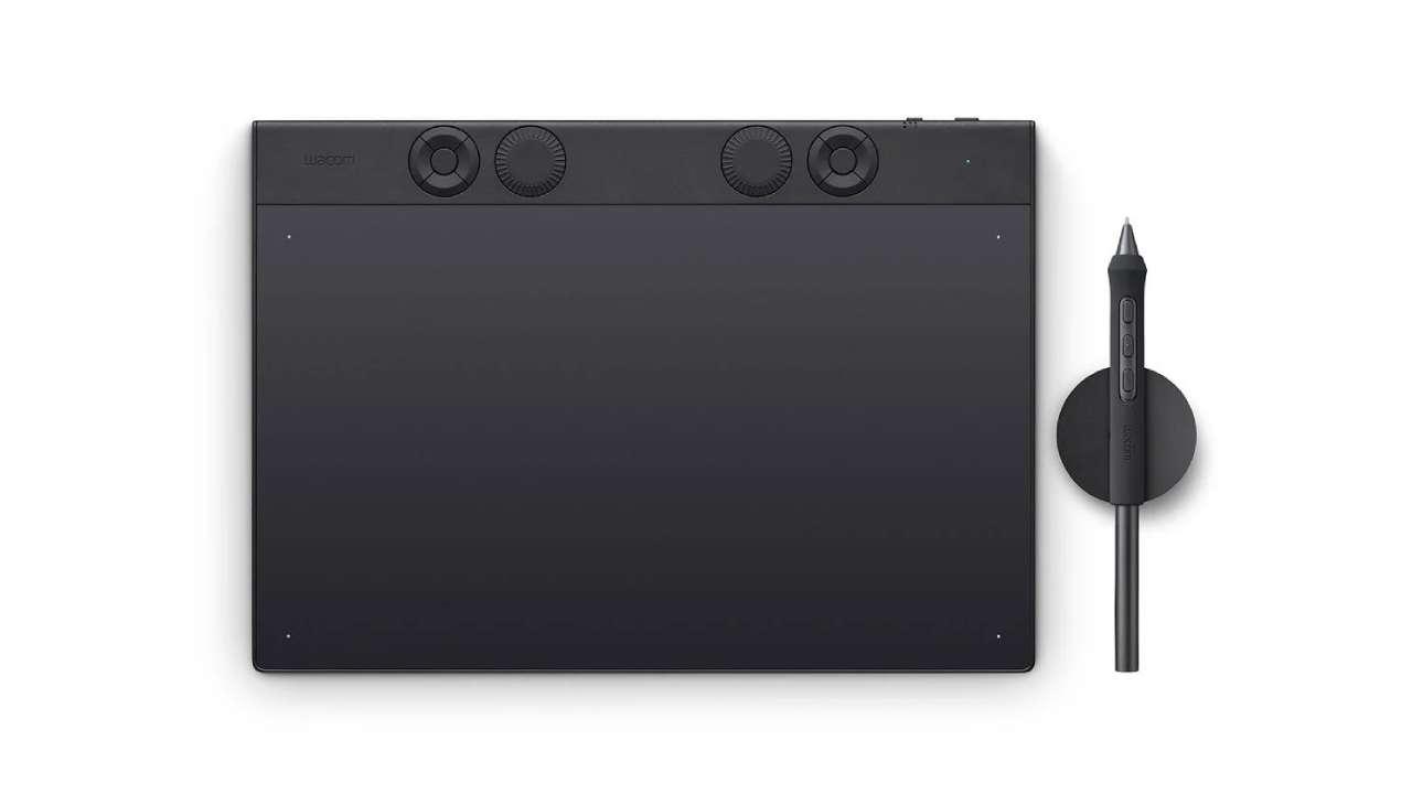Wacom Intuos Pro pen tablet used alongside a desktop monitor for digital art